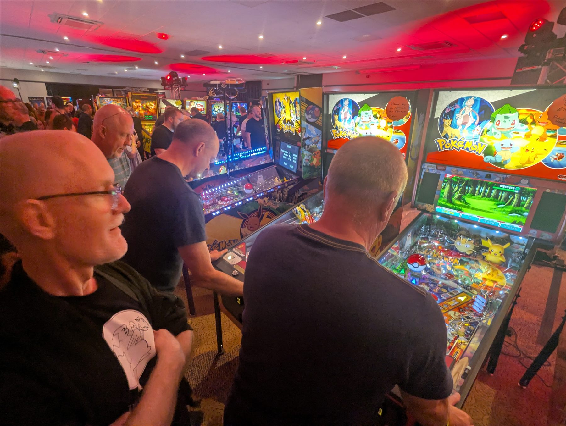 Players enjoying rows of new pinball machines at UK Pinfest