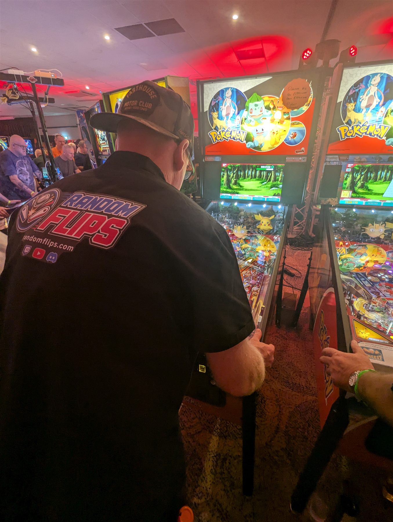 Random Flips player at a Pokémon pinball machine