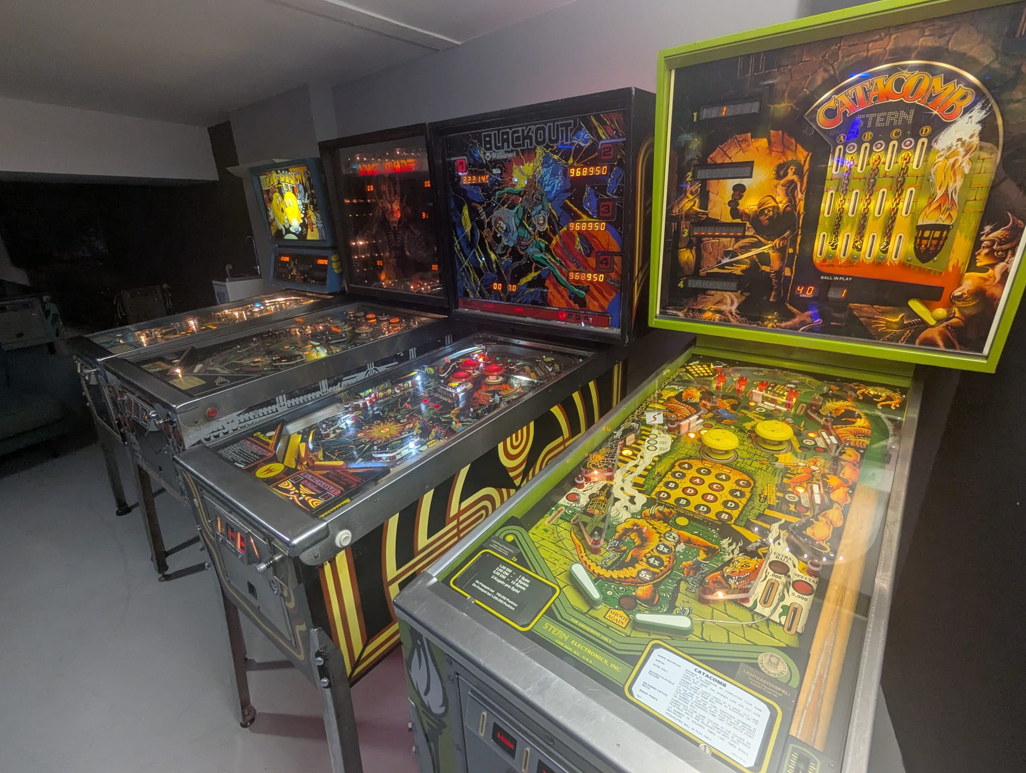 Classic pinball machines including Blackout and Catacomb at The Pinball Factory
